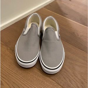 Never worn - women’s Vans grey slip on sneakers. Size 8